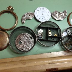 pocket watch movement disassembled for cleaning and repair